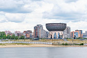 Summer cityscape with Kazan Family Center in the form of a bowl, cauldron.