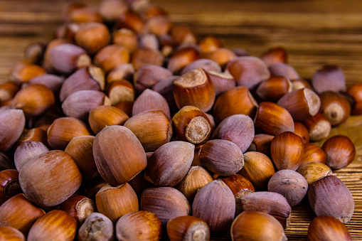 Pile of the hazelnuts on rustic wooden table