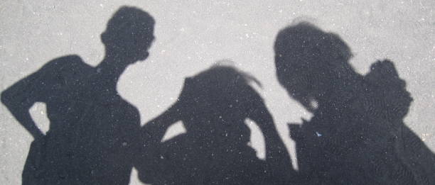 istock Shadow of a family on the pavement 1498559888