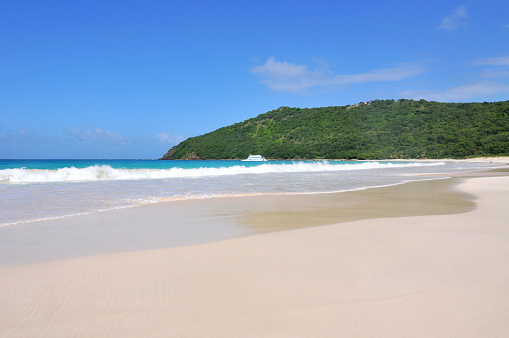 Culebra Island, Puerto Rico- October 25, 2011: Flamenco Beach is considered the second most beautiful beach in the world by Discover Channel and by far the most popular beach in Culebra Island, Puerto Rico. Its white sandy beach stretches along the entire bay, you will feel the Caribbean sun everywhere and wonder why you had waited this long.