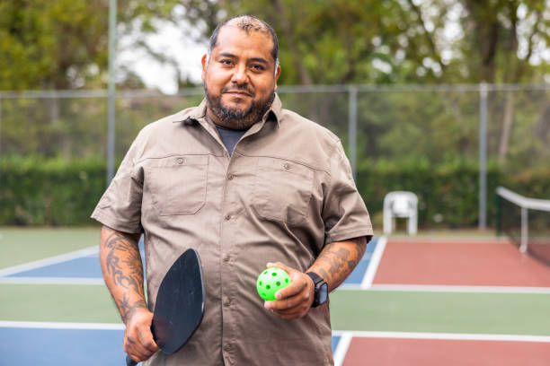 istock Hispanic Veteran with Prosthetic Legs Playing Pickleball 1498564725