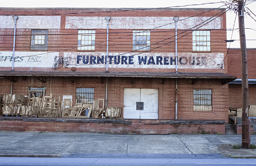 The rear of an old furniture warehouse with a loading dock in Columbus, Georgia