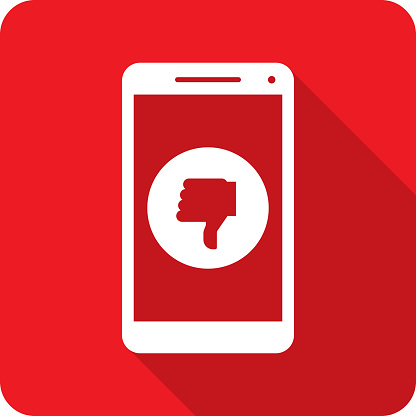 Vector illustration of a smartphone with thumbs down icon against a red background in flat style.