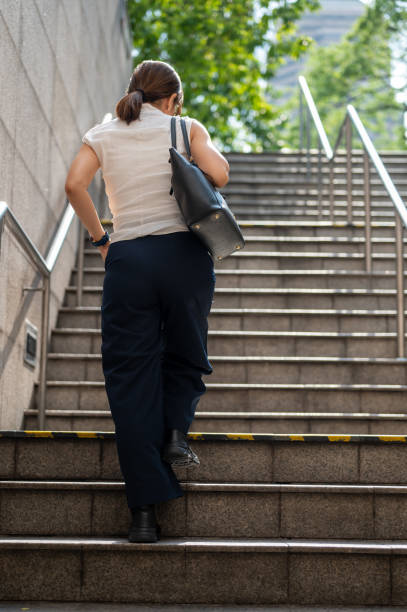 Business woman on the way to work in the city