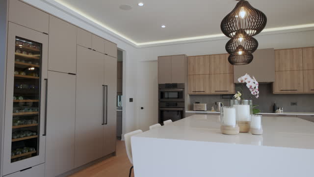 Elements of Modern Luxurious Kitchen Interior Design in a newly renovated house, move camera wide footage