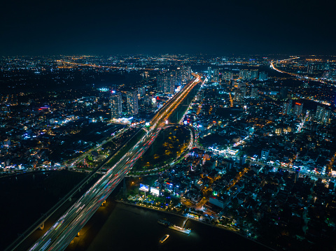 Drone view Sai Gon bridge and Tran Nao roundabout at night, Ho Chi Minh city, South Vietnam