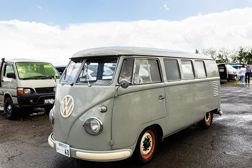 old fashioned retro camper automobile in green environment