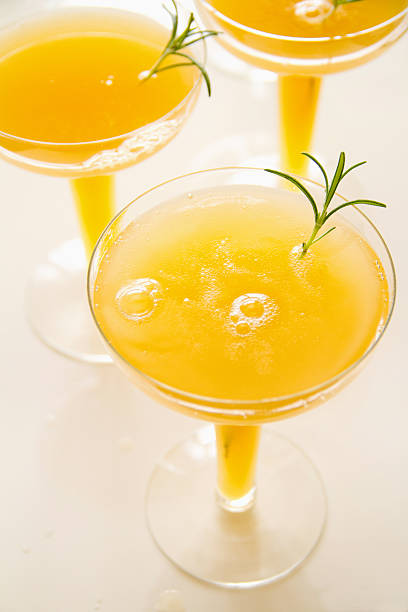 Peach and Rosemary Bellini stock photo