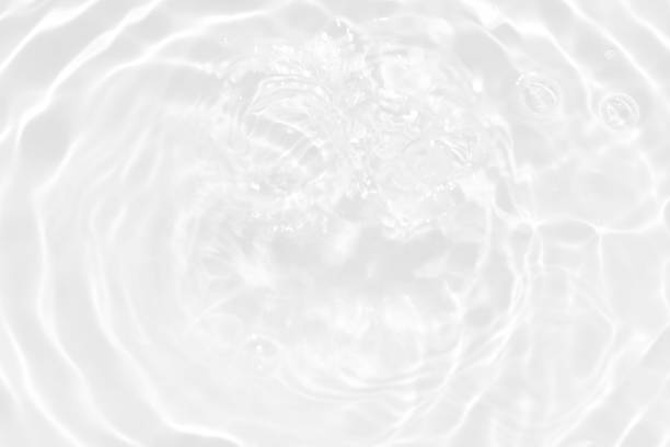 istock White water with ripples on the surface. Defocus blurred transparent white colored clear calm water surface texture with splashes and bubbles. Water waves with shining pattern texture background. 1498585456