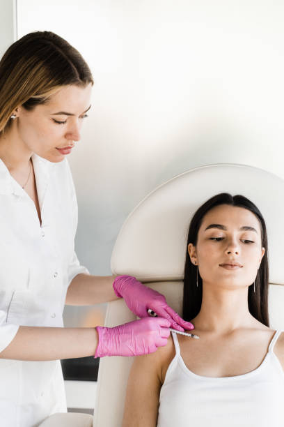 istock Cosmetologist injecting biorevitalization for moisturizing effect. Facial biorevitalization for increasing skin tone, reducing wrinkles. 1498590429