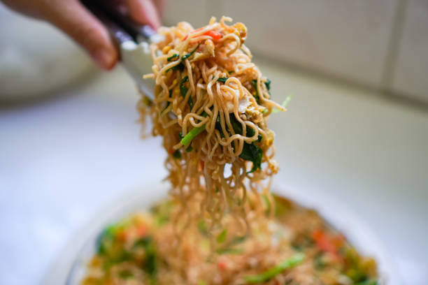 istock A close-up photo shows a home-made vegetarian stir-fried egg noodles on a dining table. 1498591292