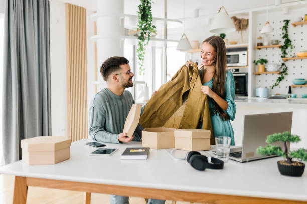 istock Young couple shopping online at home 1498594111