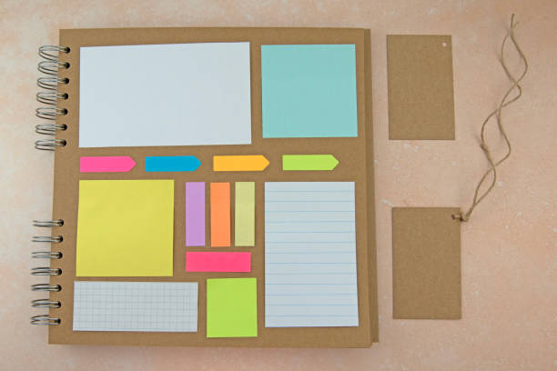 istock Coloured square paper on brown paper 1498597583