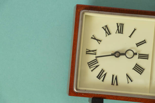 istock old soviet table clock in a wooden frame lie on the table 1498598502