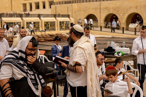 JERUSAMEL, ISRAEL - JUNE 2, 2023: Orthodox Jewish people on the Western Wall in Jerusalem, Israel