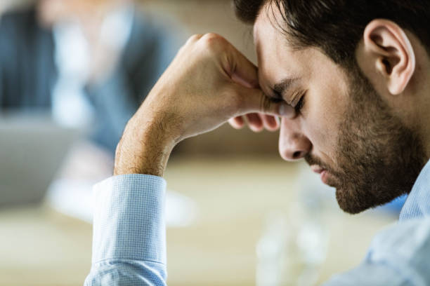 istock Businessman having a headache in the office. 1498602732