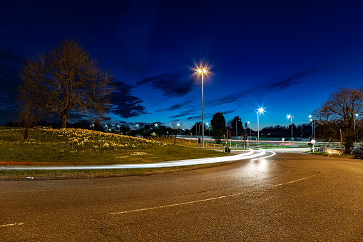 Parking lot against building at night.