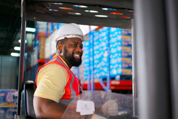 Blue collar worker work at warehouse. stock photo