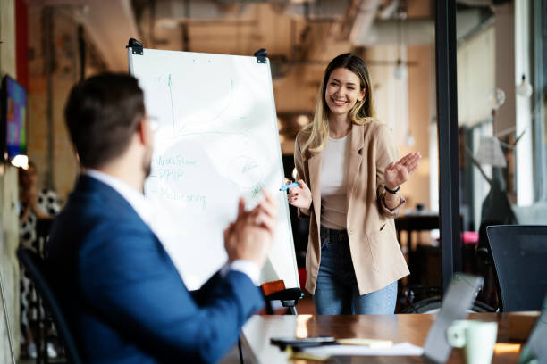 istock Businesswoman present her idea to working team. 1498608734