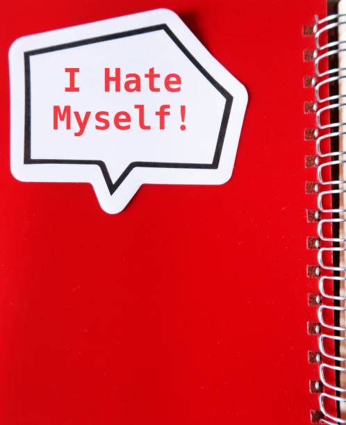 istock Word sticker on red notebook with text written I HATE MYSELF, concept of self hatred ,negative inner critic which constantly puts down, critical voice compare tell that they are not good enoug 1498609002
