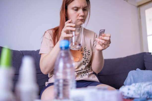 istock Drinking prescription pills for toothache 1498610681