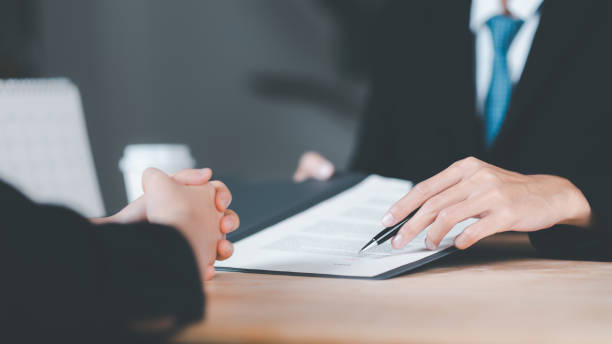 istock Businessman checking contract documents ,handle business documents and agreements ,Business contract signing ,business cooperation ,Signing to approve contract or warranty documents 1498610710