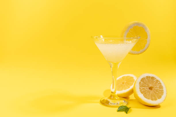 istock Fresh lemonade with lemon on yellow background 1498615347