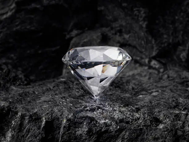 Photo of diamond on black coal background