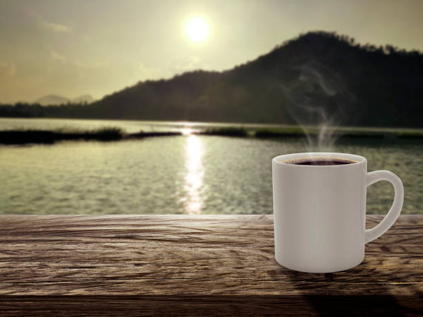 istock Morning coffee with mountain background at sunrise 1498618307