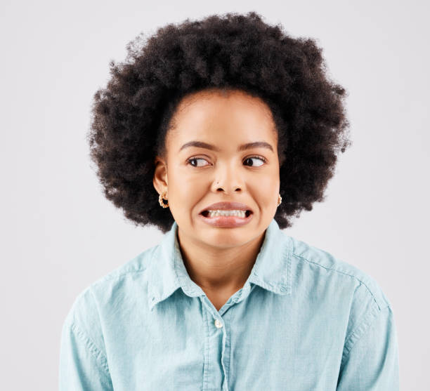 istock Black woman, afro and oops face in studio with comic expression for fail by white background. Girl, model and african student with mistake, accident or thinking of bad decision in memory by backdrop 1498618643
