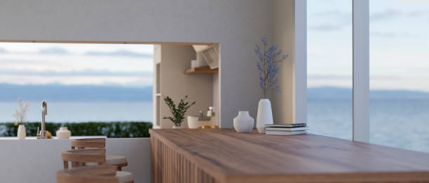 istock Copy space on a wooden tabletop against the window in a modern contemporary kitchen 1498619936