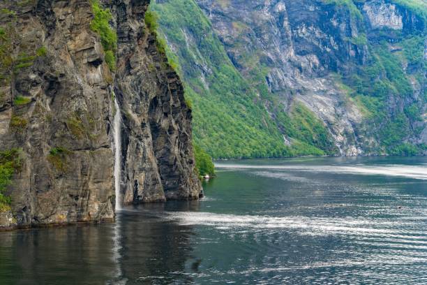 istock a scenic area next to mountains and river with a waterfall 1498620303