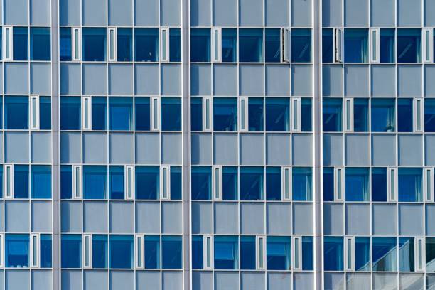 istock Facade of a contemporary structure featuring multiple glass windows 1498620313