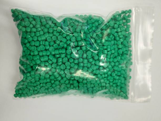 istock Green of plastic polymer granules for background. 1498621656
