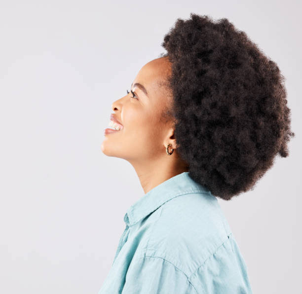 istock Black woman, profile and happiness smile in a studio thinking and feeling relax. Isolated, white background and happy young model with youth and natural afro with female empowerment and idea 1498622109