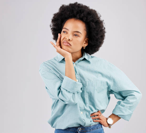 istock Bored, confused and a thinking black woman with a decision isolated on a white background in a studio. Idea, boredom and an African girl with doubt about a plan, solution or ideas on a backdrop 1498622113