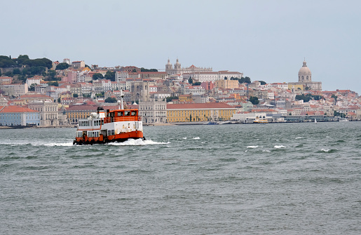 Old ferry crossing the water in Lisbon, Portugal