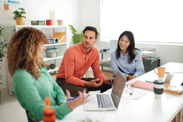 istock Colleagues working together at the office 1498624130