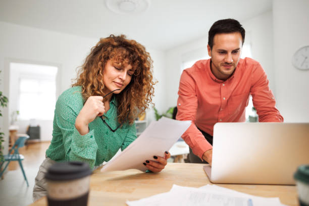 istock Two young colleagues working together at office 1498624406