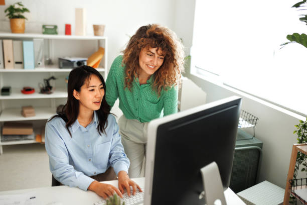 istock Two female colleagues working together at modern office 1498624515