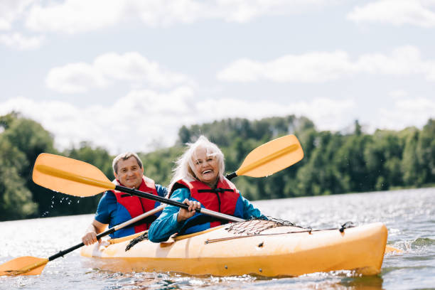 istock Happy senior active couple kayaking on lake 1498625852
