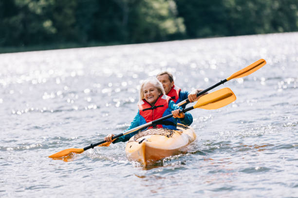 istock Happy senior active couple kayaking on lake 1498625855