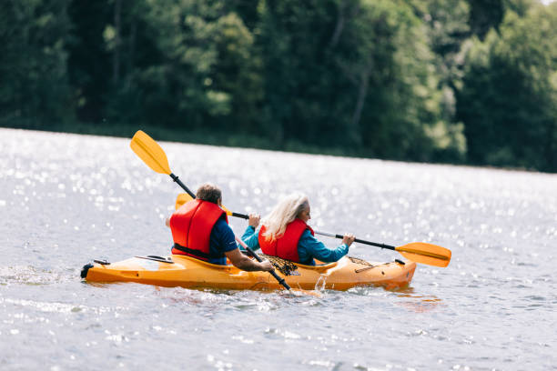 istock Happy senior active couple kayaking on lake 1498625859
