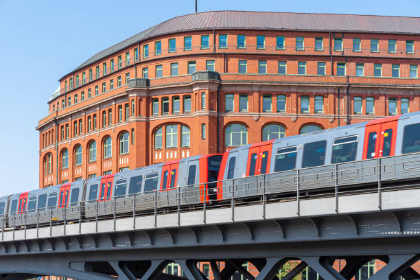 Blurred motion of subway train in city against building