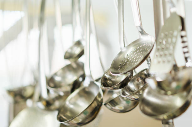 Trowels, ladle hanging in the kitchen. Selective sharpness lies on a ladle