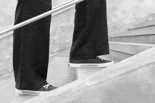 istock a woman climbs the steps in the passage 1498630158