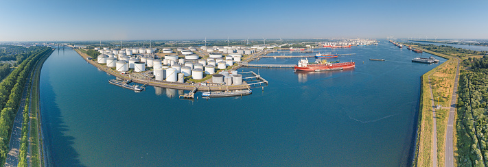Panoramic drone picture from port Rotterdam with big transport ships during daytime