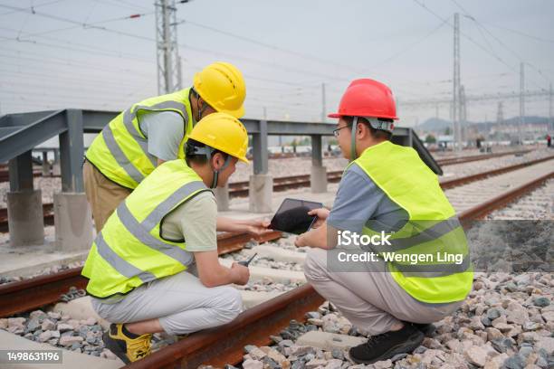 Railway Workers Are Exchanging Work Stock Photo - Download Image Now - 30-34 Years, Adult, Adults Only