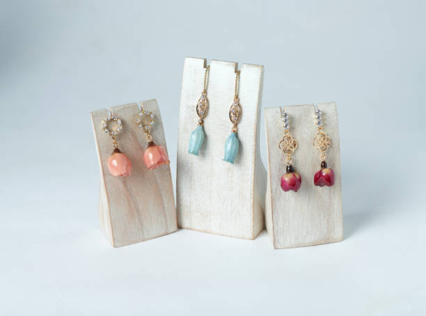 istock Resin earrings mixed with dried flowers isoalted on white background 1498632446