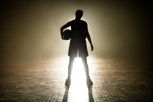 istock Basketball player standing on court 1498634478